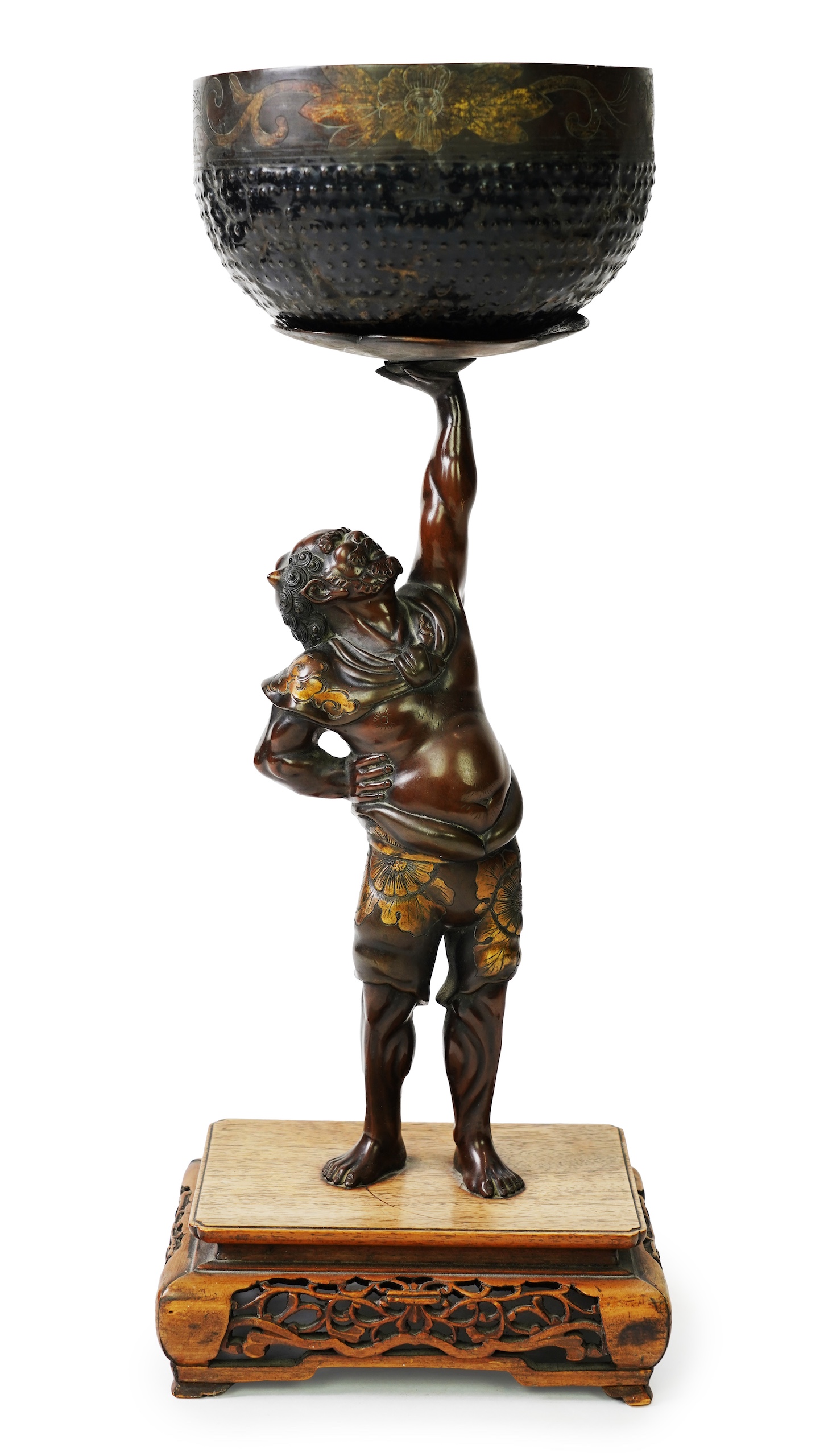A Japanese bronze figure of an Oni holding a temple bell aloft, Meiji period, in Miyao style